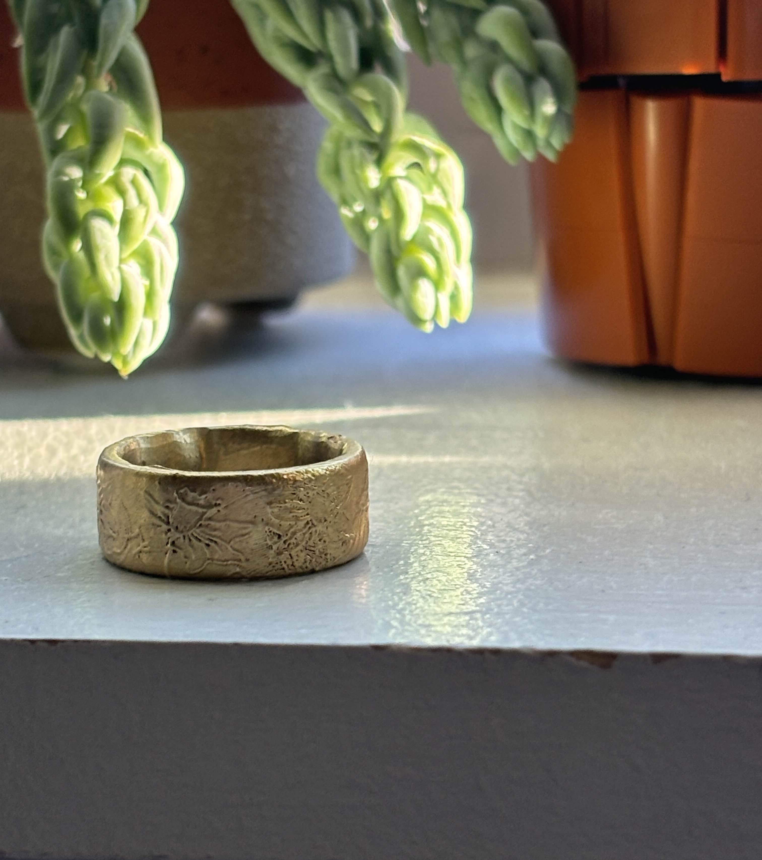 A close-up of the wax casted ring after polishing